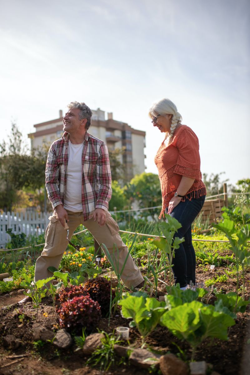 Man and women that are working in their own garden